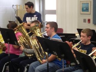 Chad Kuchenmeister plays Euphonium while Mr. Feller looks on.